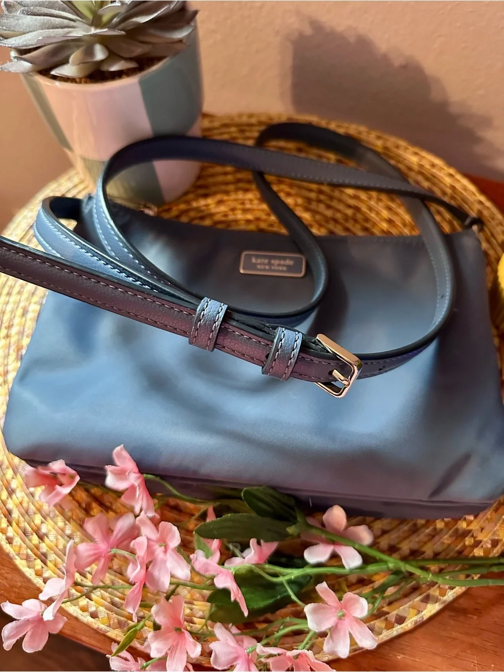 Kate Spade navy blue leather crossbody bag with adjustable strap